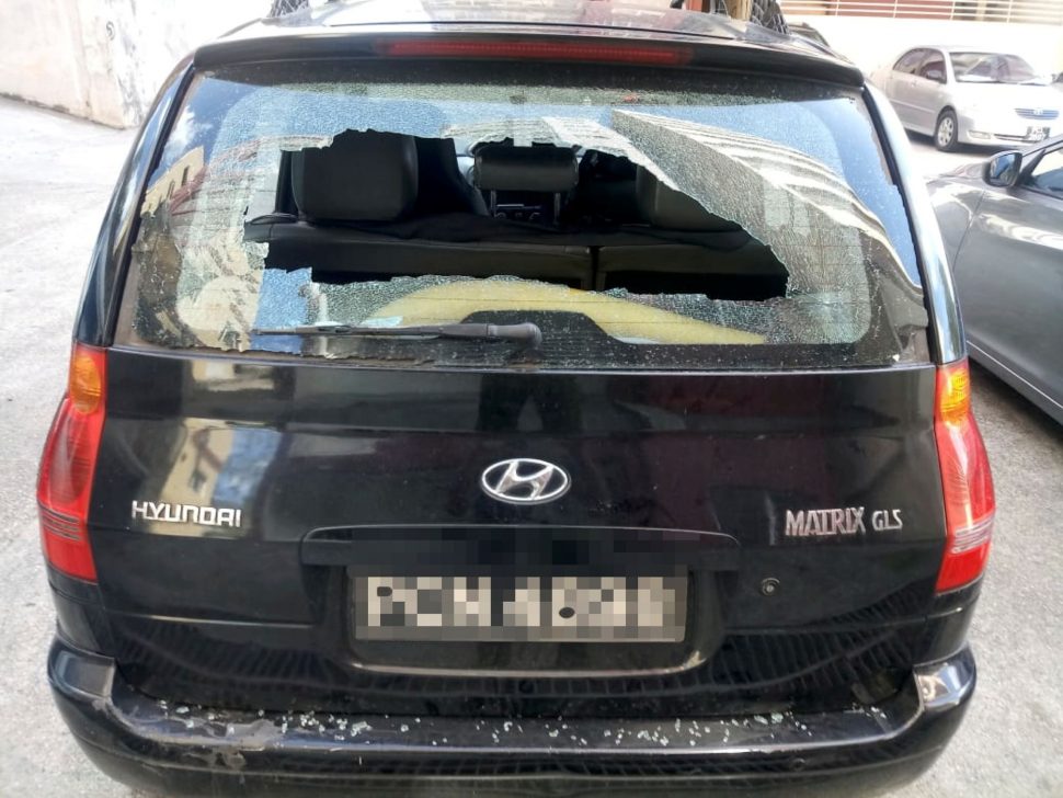 The tenant’s vandalised vehicle outside Clifton Towers in Port-of-Spain yesterday.