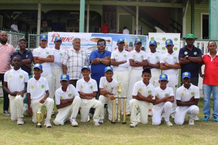 The winning Demerara under - 15 team pose for a photo with the tournament’s sponsor and GCB officials (Royston Alkins photo)