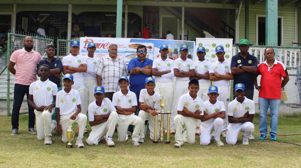 The winning Demerara under – 15 team pose for a photo with the tournament’s sponsor and GCB officials (Royston Alkins photo)