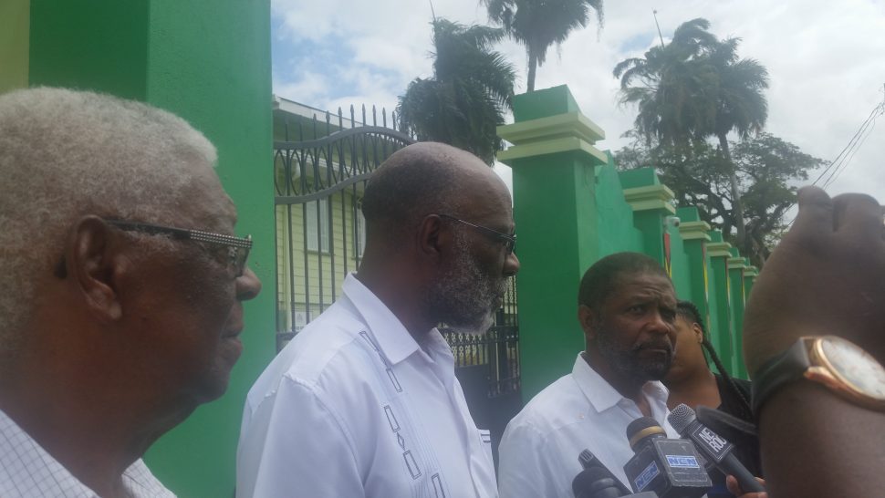 The government-nominated commissioners speaking to reporters today. From left are Desmond Trotman, Vincent Alexander and Charles Corbin