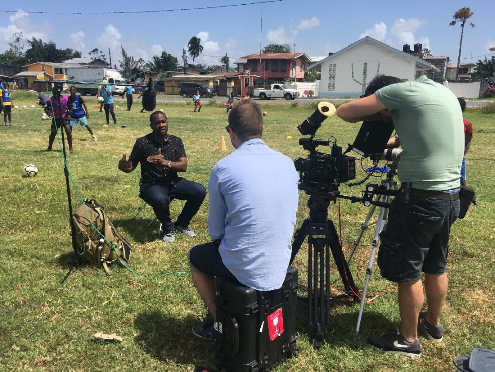 FIFA Football Producer Andrew Tomczak conducting an interview with GFF President Wayne Forde at a GFF Kool Kidz Grassroots Session in Georgetown.
