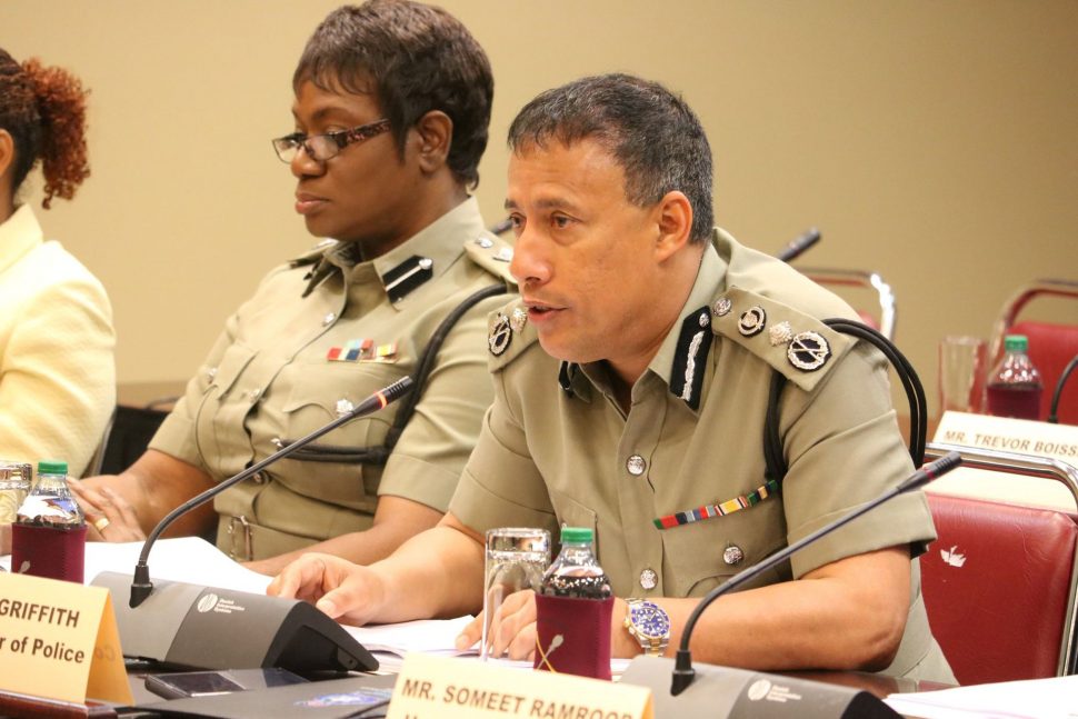 Commissioner of Police Gary Griffith at yesterday’s Public Administration and Appropriations Committee meeting. At left is ACP Erla Christoper.