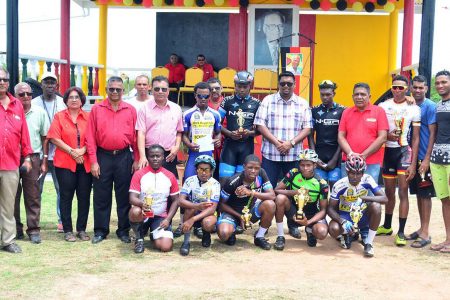 The top prize winners of the Cheddi Jagan road race yesterday along with members of the PPP/C and race organizer, Hassan Mohamed pose for a photo following the fixture. (Orlando Charles photo)
