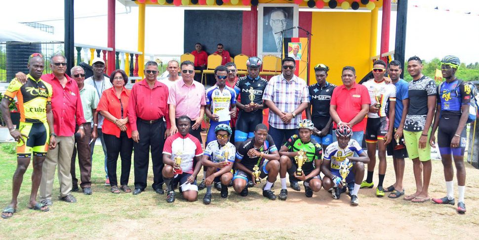 The top prize winners of the Cheddi Jagan road race yesterday along with members of the PPP/C and race organizer, Hassan Mohamed pose for a photo following the fixture. (Orlando Charles photo)
