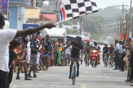 Brighton John made hay in the brilliant sunshine yesterday in Bartica lapping all but six of the starters to take the top honours of the grueling 35-lap (42 miles) event after two hours, 22 minutes and 52 seconds of intense racing. (Orlando Charles photo)