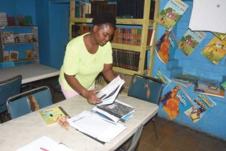 Anderson attends to a classroom at Hydel during her rounds, as part of her functions as a member of Hydel's ancillary staff. (Photos: Naphtali Junior)
