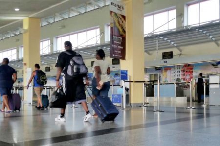 Passengers walk through the Piarco International Airport yesterday, hours after the US announced it had grounded all Boeing 737 Max aircraft worldwide.