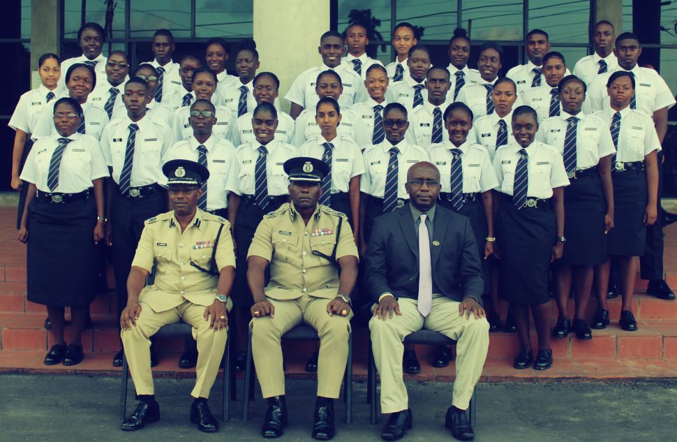From left (sitting): Force Training Officer, Assistant Commissioner Clifton Hicken; Deputy Commissioner – Administration, Paul Williams, and Deputy Chief Immigration Officer, Superintendent Ewart Wray, along with the 36 new Immigration Officers.