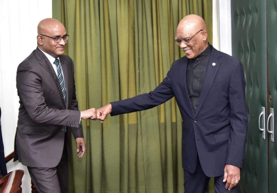 President David Granger (right) and Opposition Leader Bharrat Jagdeo in a fist bump before their talks last week. (Ministry of the Presidency photo)
