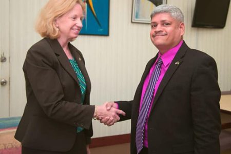 US Ambassador Sarah-Ann Lynch meeting Minister in the Ministry of Finance, Jaipaul Sharma (Facebook photo)