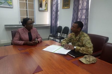 Minister of Education, Dr. the Hon. Nicolette Henry in conversation with Captain Solomon Bannister of the US Army