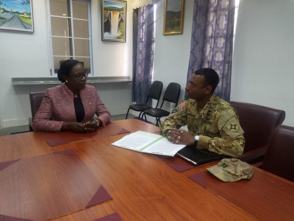 Minister of Education, Dr. the Hon. Nicolette Henry in conversation with Captain Solomon Bannister of the US Army