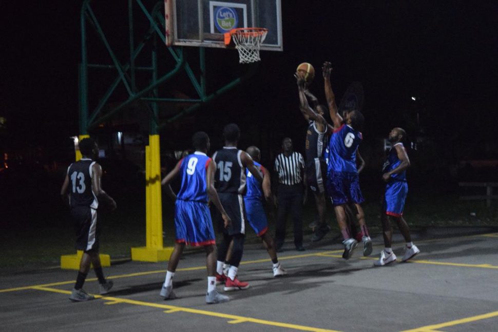 Scenes from the first division clash between Pepsi Sonics  and UG Trojans on the opening night of the GABA/’Lets Bet Sports’ Knockout Championship at the Burnham Court, Middle and Carmichael Streets.
