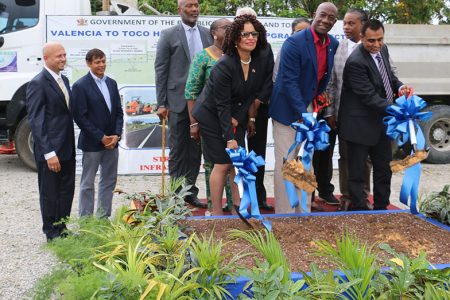 Prime Minister Dr Keith Rowley flanked by MP for Toco/Sangre Grande Glenda Jennings- Smith, left, and Minister of Works and Transport Rohan Sinanan, turn the sod for a segment of the Valencia to Toco Highway, yesterday at Valencia.