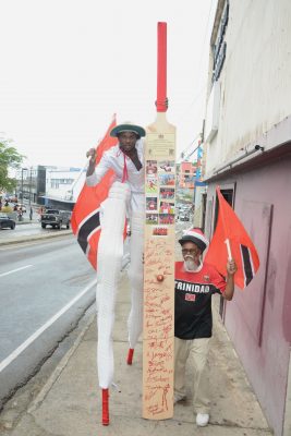 Kaiso Moko Jumbie leader Junior Bisnath, right, and Kayode Duval on stilts leave for the United States to perform in the circus next week.