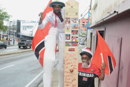 Kaiso Moko Jumbie leader Junior Bisnath, right, and Kayode Duval on stilts leave for the United States to perform in the circus next week.