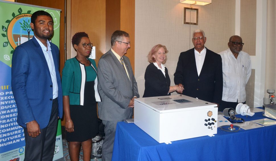 US Ambassador Sarah-Ann Lynch (third from right) hands over a weather station to Minister of Agriculture Dr Noel Holder. At right is Deputy Director of the CCCCC, Dr Ulric Trotz. At left is Chief Hydrometeorological Officer (ag) Dr Garvin Cummings. (Ministry of Agriculture photo)
