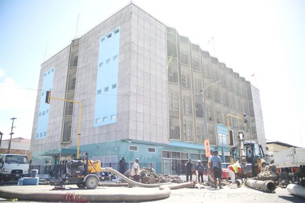 Guyana Water Incorporated technicians finalising the replacement of a transmission main in front of the Bank of Guyana, located on Church Street and the Avenue of the Republic, after a breakage resulted in the disruption of Georgetown’s water supply. (Terrence Thompson photo)