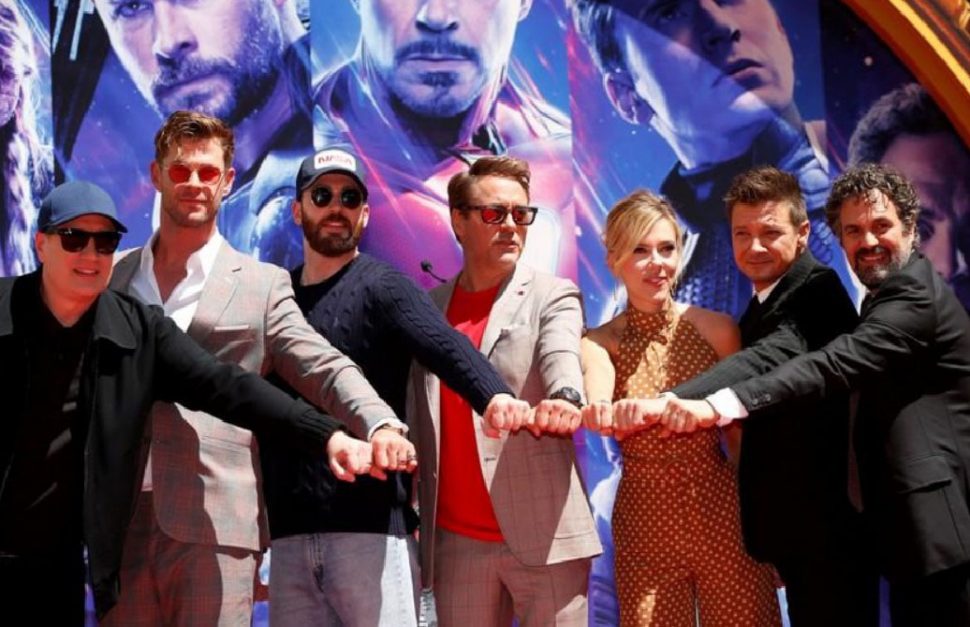 Actors Robert Downey Jr., Chris Evans, Mark Ruffalo, Chris Hemsworth, Scarlett Johansson, Jeremy Renner and Marvel Studios President Kevin Feige pose for a picture during a ceremony to place their handprints in cement, at the TCL Chinese Theatre in Hollywood, Los Angeles, California, U.S. April 23, 2019. REUTERS/Mario Anzuoni
