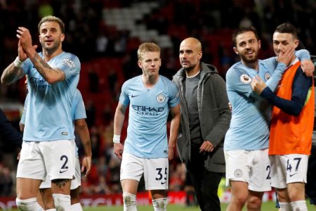 Manchester City manager Pep Guardiola (centre) and Oleksandr Zinchenko after the match with Manchester United on Wednesday. Action Images via Reuters/Carl Recine
