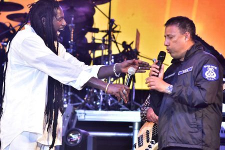 Police Commissioner Gary Griffith appears on stage with Jamaica reggae artiste Buju Banton at the I Am Legend concert at the Queen’s Park Savannah on Sunday.