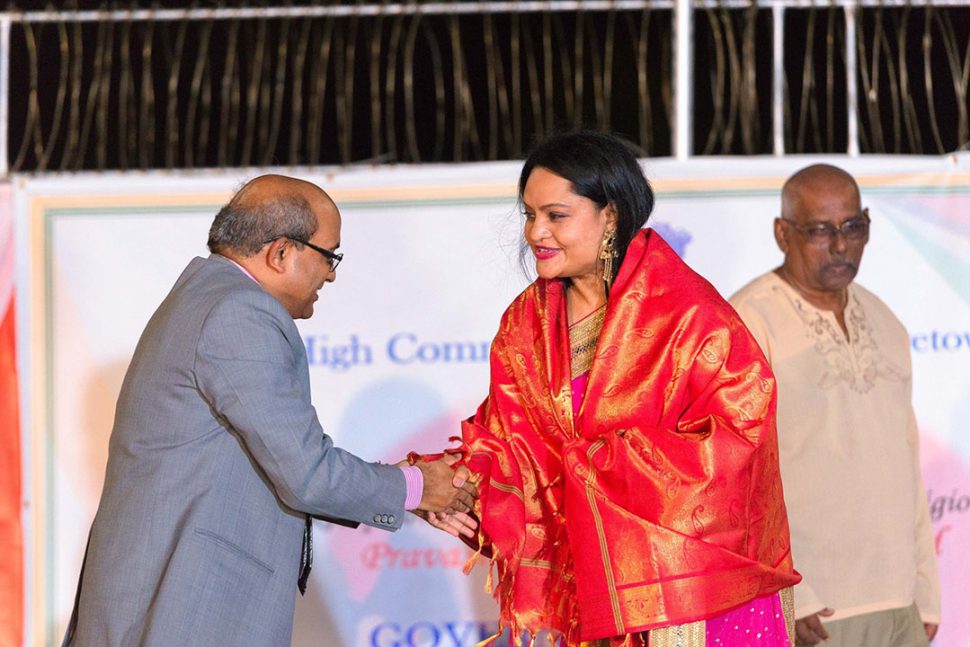 Indian High Commissioner Mahalingam Venkatachalam congratulating the Hindu Dharmic Sabha’s President Dr. Vindhya Persaud at a special event at India House in Georgetown to celebrate the conferral of the Pravasi Samman Award on the Guyana Hindu Dharmic Sabha by the President of India, Shri Ram Nath Kovind. (Photo from the Guyana Hindu Dharmic Sabha’s Facebook page)
