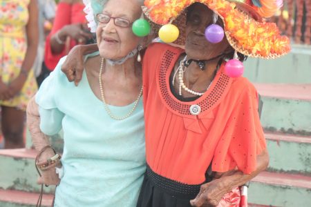 Sheila King (at left) and Cicely Harding exhibiting their flair at a previous Inner Wheel Club hat show. (Stabroek News file photo)
