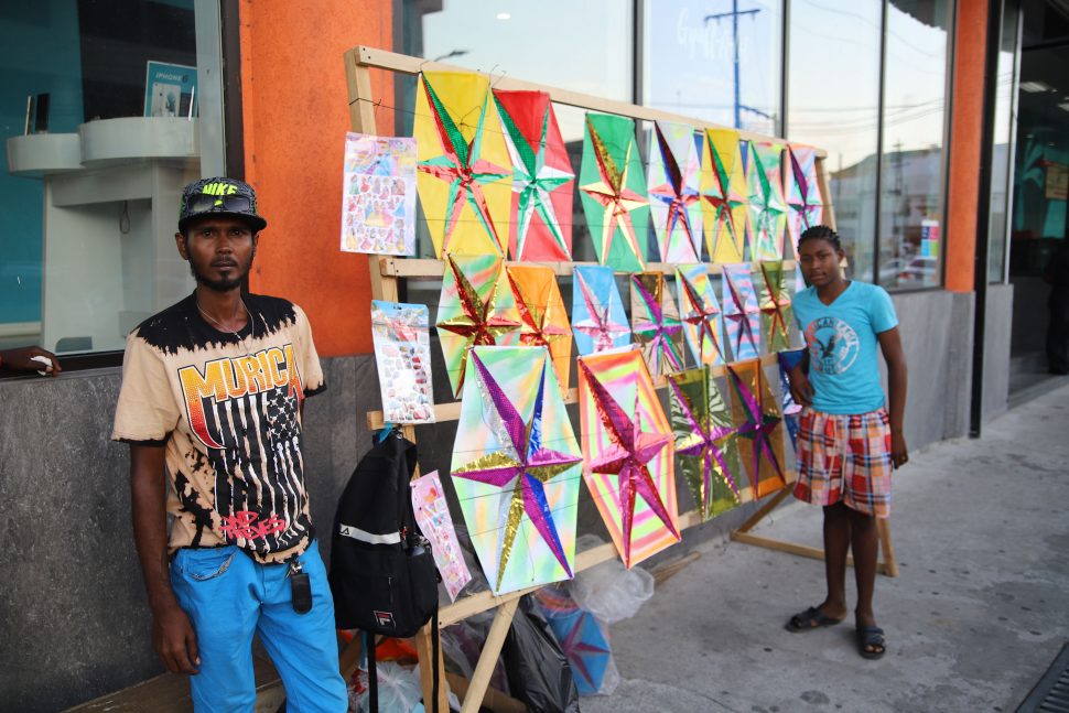 Locally made kites on sale on Camp Street yesterday.