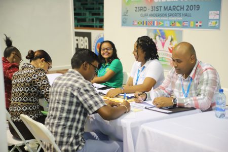Representatives of DDL interviewing youths at the Department of Youth’s job fair yesterday at the Cliff Anderson Sports Hall in Georgetown. (Terrence Thompson photo)
