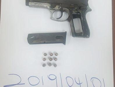 The unlicensed pistol and rounds that were found in possession of one of the suspects.