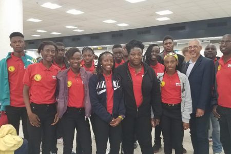 Team Guyana pose for a photo yesterday at the Miami International Airport with former Member of Parliament, Dominic Gaskin.
