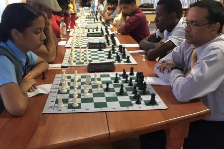 St Stanislaus student Chelsea Juma, the only woman participant in the qualifier for the 2019 National Championship, faces Shiv Nandalall, a former national chess player and a past president of the Guyana Chess Federation. Nandalalll disappeared from chess in 2012 but is now back. Juma, meanwhile, is fine-tuning her tactics and strategies for participation in the Caribbean Junior Chess Championship to be held in Curacao this month. (Photo: Irshad Mohammed)