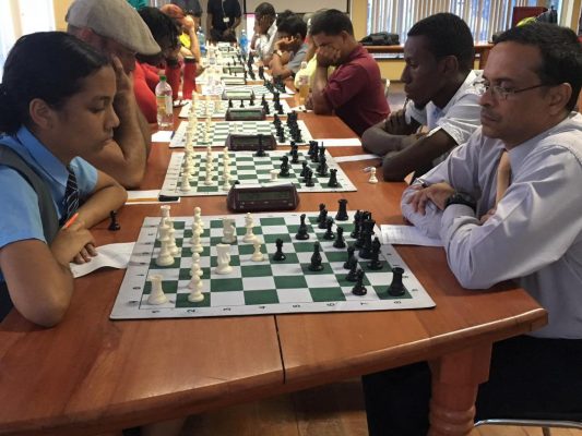 St Stanislaus student Chelsea Juma, the only woman participant in the qualifier for the 2019 National Championship, faces Shiv Nandalall, a former national chess player and a past president of the Guyana Chess Federation. Nandalalll disappeared from chess in 2012 but is now back. Juma, meanwhile, is fine-tuning her tactics and strategies for participation in the Caribbean Junior Chess Championship to be held in Curacao this month. (Photo: Irshad Mohammed)
