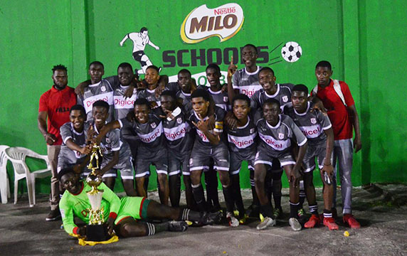 The victorious Christianburg/Wismar unit of Linden posing with the coveted Milo Secondary School Football Championship after defeating Lodge Secondary 1-0 at the Ministry of Education ground.