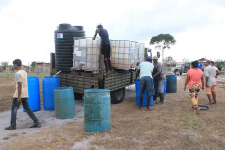 Residents of Circuit Ville receiving water from the CDC