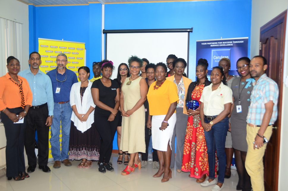 Some of the participants along with representatives of Courts and Cerulean Incorporated at yesterday’s launching of the ‘Grow your Business’ programme. (Terrence Thompson photo)