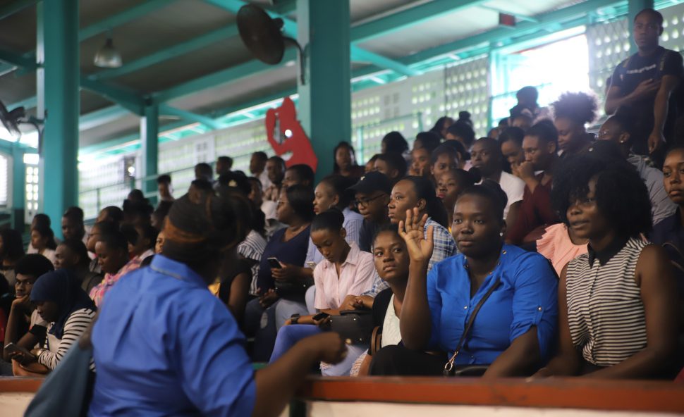 Youths waiting to be interviewed by companies present at the job fair held at the Cliff Anderson Sports Hall yesterday. (Terrence Thompson photo)