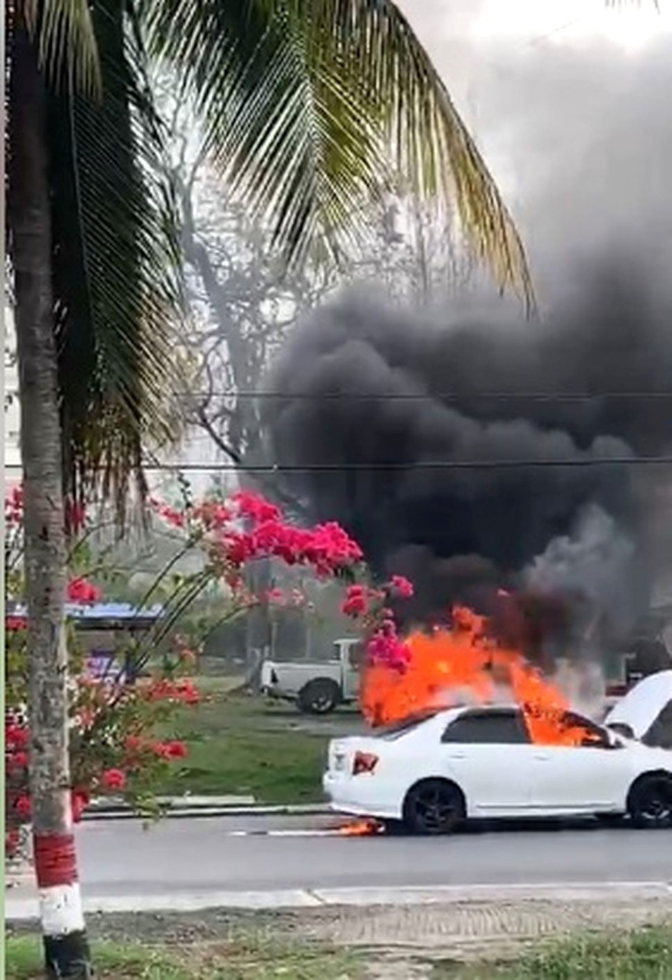 A White Axio sedan on fire in Gasparillo in early March.