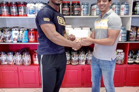 Jamie McDonald, CEO of Guyana’s leading supplement and gym equipment supplier, recently handed over a cheque to Carlos Petterson-Griffith to help the behemoth offset expenses for the imminent StrongFit Barbados 2019.