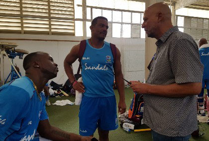 CWI president Ricky Skerritt engages the attention of West Indies fast bowlers Kemar Roach (left) and Shannon Gabriel during yesterday’s day one of the training camp at 3W’s Oval. (Photo courtesy CWI Media)

