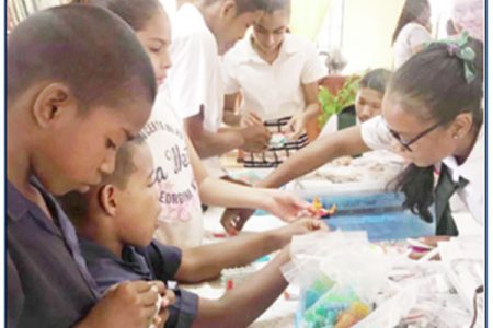Lethem students ‘getting their feet wet’ during STEM Guyana’s recent ground-breaking Workshop at the community library. At their request the students have been cleared to participate in next month’s National Robotics Competition.
