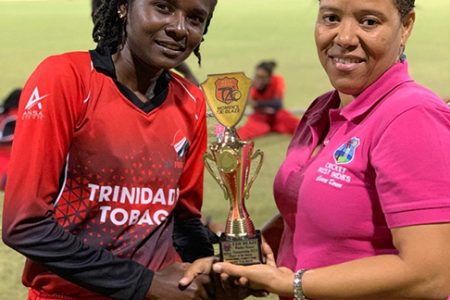 Felicia Walters receives her player of the match award from CWI’s Josina Luke
