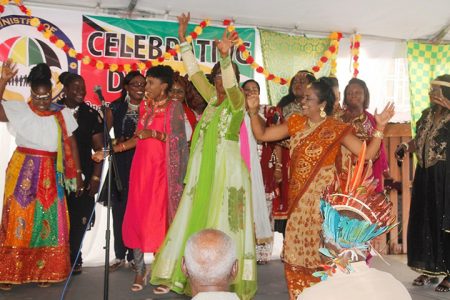 Arrival celebration: Staff of the Ministry of Social Protection on Friday during a grand cultural celebration hosted at the ministry’s office to mark Arrival Day, which is celebrated today. (Department of Public Information photo) 