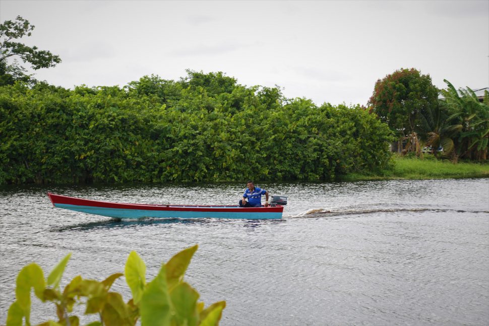  A resident makes his way along the Mahaica Creek
