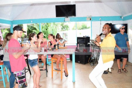 Joaquin entertaining patrons at Pig On De Rock after the press launch of De First Citizens/Digicel De Big Show calypso tent. (Picture by Reco Moore.)