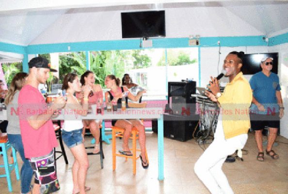 Joaquin entertaining patrons at Pig On De Rock after the press launch of De First Citizens/Digicel De Big Show calypso tent. (Picture by Reco Moore.)