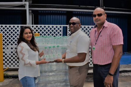 Clive Pellew, Waters Brand Manager (centre) made the presentation to Serena McKenzie, who represented  Balkaran in the presence of  Gavin Jodhan, Branches Controller.