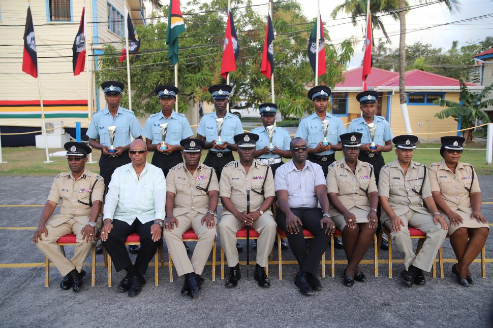 Senior members of the Guyana Police Force posed with the most outstanding ranks for each recruit course. (Seated fourth from left is Commissioner of Police Leslie James.)
