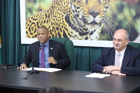 Department of Energy (DoE) Head Dr Mark Bynoe and advisor Matthew Wilks at the press conference yesterday (Terrence Thompson photo)