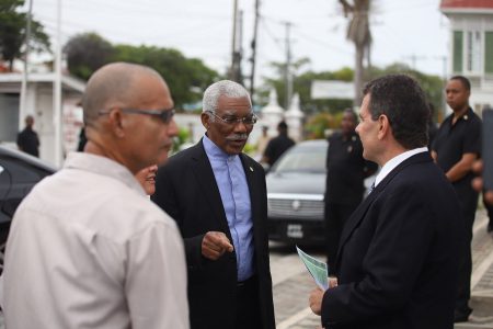 President David Granger and the Honorary Consul of Portugal Michael Correia Jr interact during the commemoration ceremony in honour of the 184th Anniversary of the arrival of the Portuguese in Guyana. 